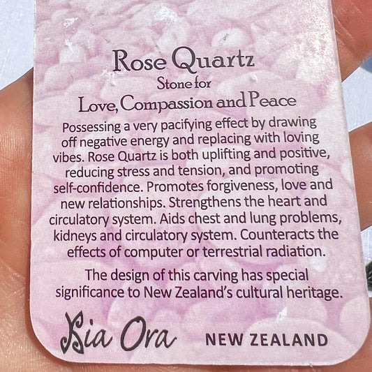 Close-up of a Rose Quartz meaning card from Aotearoa New Zealand, describing the stone as one for love, compassion, and peace, promoting forgiveness, self-confidence, and calm energy.