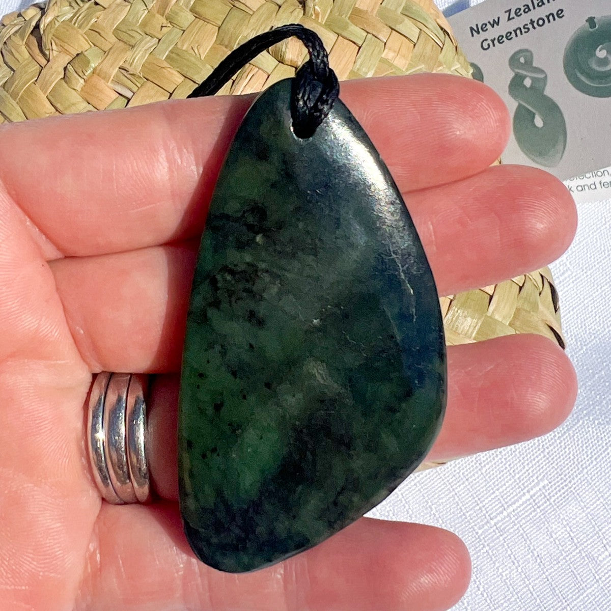 New Zealand greenstone freeform pendant – genuine pounamu with unique natural patterns. Adjustable cord, kete, and meaning card included. Ships fast from Australia. Free shipping automatically included.