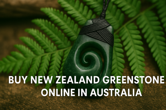 Authentic New Zealand greenstone koru pendant on fern background – buy pounamu online in Australia.
