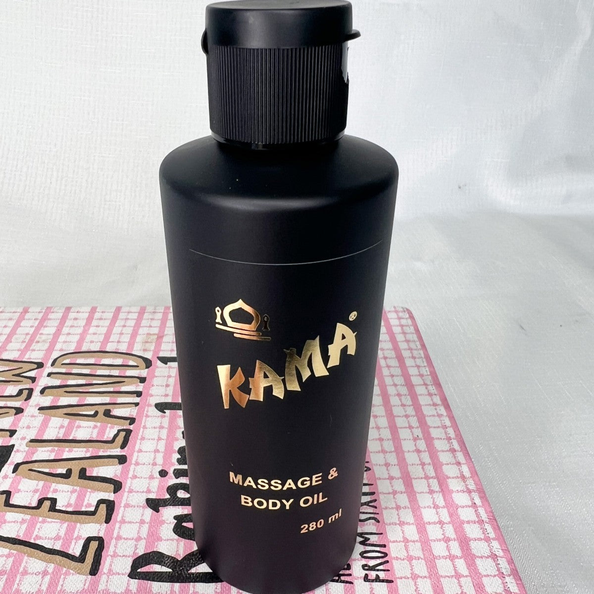 Kama Massage & Body Oil in plastic bottle – infused with original Kama perfume scent, available to buy online in Australia