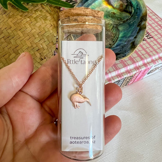 Rose gold Kiwi bird necklace by Little Taonga in glass gift bottle – Treasures of Aotearoa New Zealand