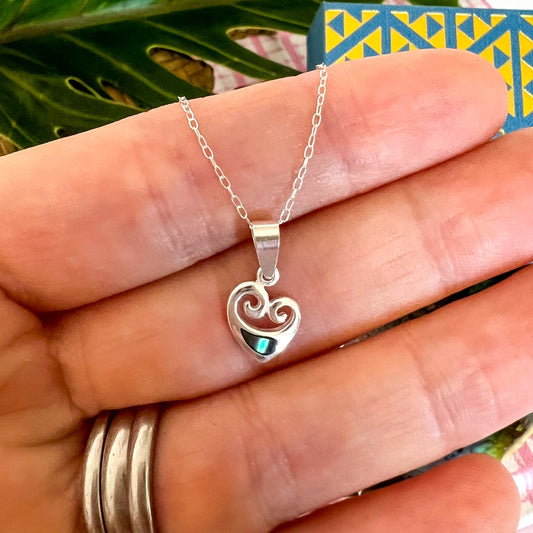 Sterling silver koru heart necklace with paua shell inlay by Little Taonga – NZ symbol of love, growth, and new beginnings