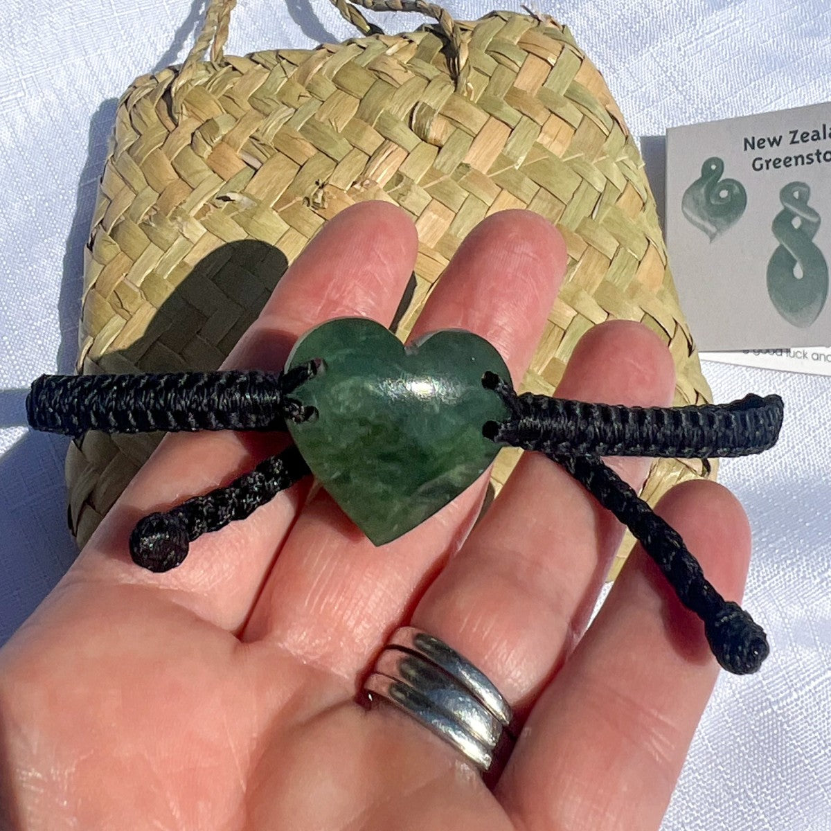 25mm New Zealand greenstone heart bracelet – genuine pounamu symbolising love, friendship, and connection. Adjustable braided cord with kete and meaning card. Ships fast from Australia. Free shipping on orders over $100.