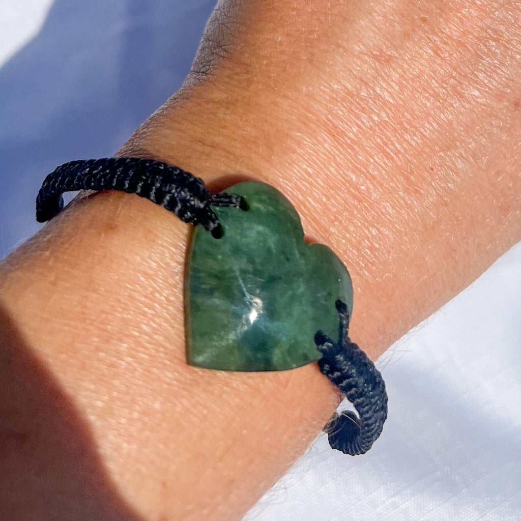 25mm New Zealand greenstone heart bracelet – genuine pounamu symbolising love, friendship, and connection. Adjustable braided cord with kete and meaning card. Ships fast from Australia. Free shipping on orders over $100.