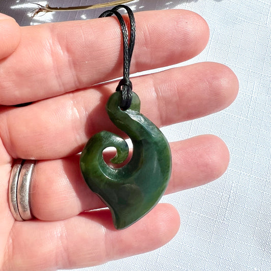35mm New Zealand greenstone koru pendant – genuine pounamu symbolising growth, renewal, and harmony. Includes kete and meaning card. Adjustable cord. Ships fast from Australia. Free shipping over $100