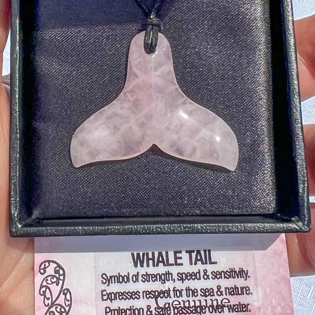 Rose quartz Whale Tail pendant necklace on a black cord, symbolising strength, sensitivity, and protection over water — hand-carved in New Zealand.