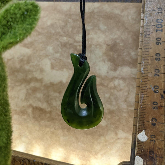 NZ greenstone hook pendant 50mm on adjustable cord – authentic pounamu necklace symbolising strength and safe travels