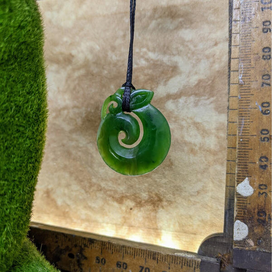 35mm New Zealand greenstone koropepe necklace – genuine pounamu symbolising protection, strength, and spiritual guidance. Adjustable cord. Ships fast from Australia. Free shipping over $100.