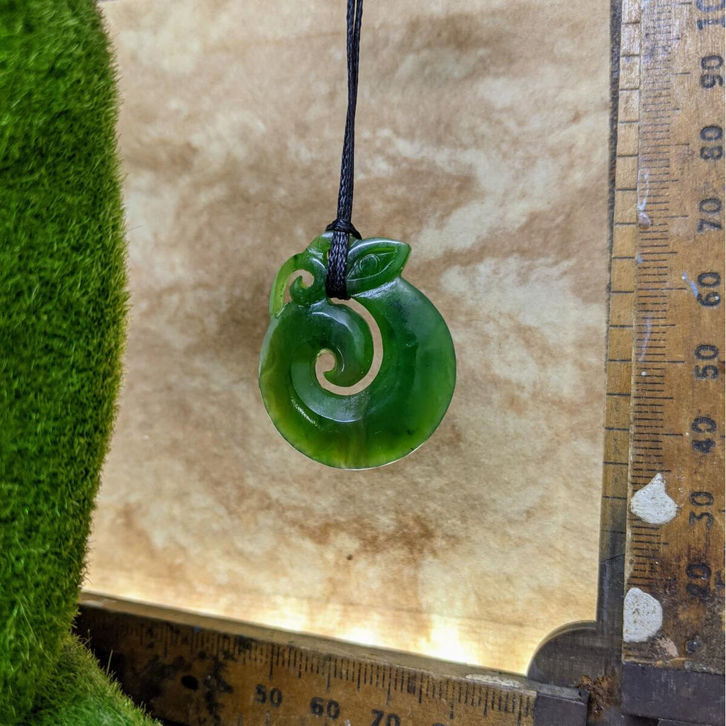 35mm New Zealand greenstone koropepe necklace – genuine pounamu symbolising protection, strength, and spiritual guidance. Adjustable cord. Ships fast from Australia. Free shipping over $100.