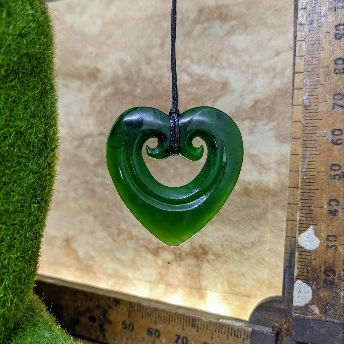 38mm New Zealand greenstone smiling heart necklace – genuine pounamu symbolising love, compassion, and positivity. Adjustable cord. Ships fast from Australia. Free shipping over $100.