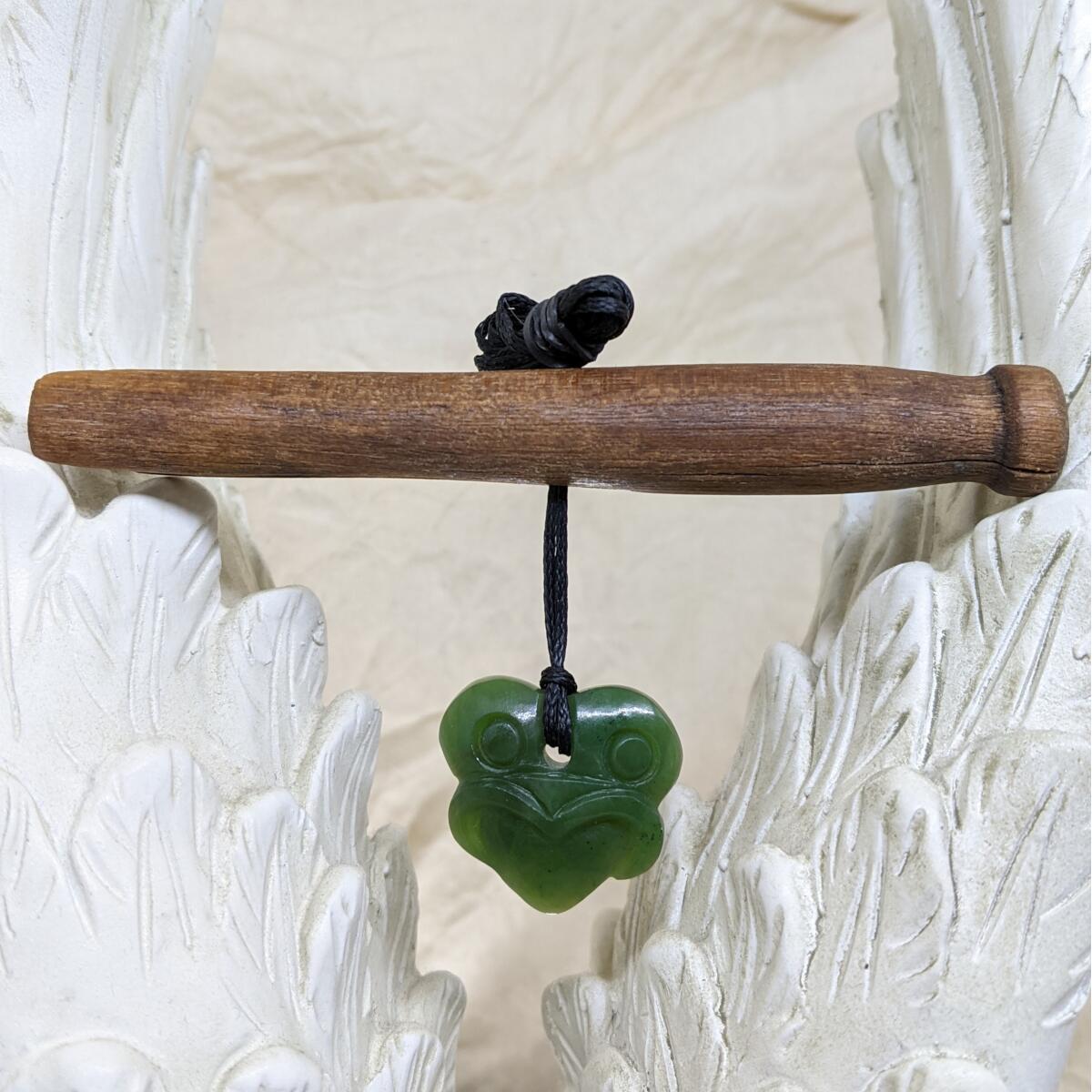 25mm New Zealand greenstone tiki pendant with adjustable cord – genuine pounamu. Ships fast from Australia. Free shipping over $100.