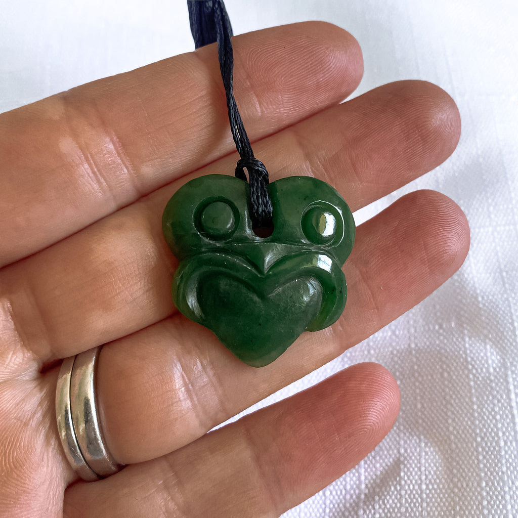 25mm New Zealand greenstone tiki pendant with adjustable cord – genuine pounamu. Ships fast from Australia. Free shipping over $100.