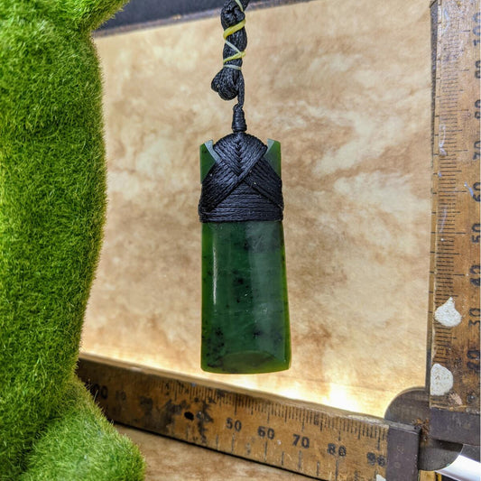60mm New Zealand greenstone toki necklace – genuine pounamu symbolising courage, strength, and leadership. Adjustable cord, kete, and meaning card included. Ships fast from Australia. Free shipping included.