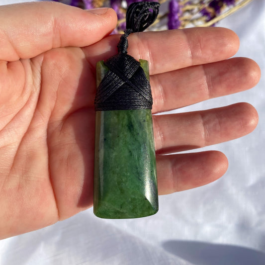 60mm New Zealand greenstone toki necklace – genuine pounamu symbolising courage, strength, and leadership. Adjustable cord, kete, and meaning card included. Ships fast from Australia. Free shipping included.