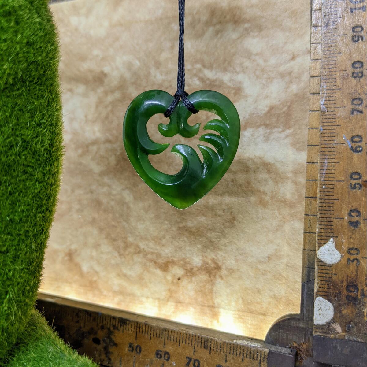 35mm New Zealand greenstone wave heart necklace – genuine pounamu symbolising love, friendship, and connection to the sea. Adjustable cord. Ships fast from Australia. Free shipping over $100.